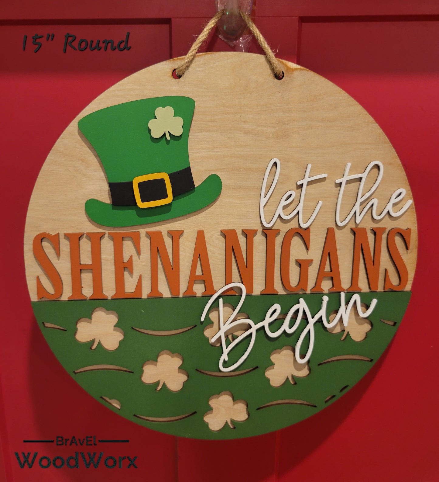 A festive St. Patrick's Day door hanger featuring a four-leaf clover design and the message 'Happy St. Patrick's Day! May your day be as lucky as a four-leaf clover!' The back of the hanger includes an Irish blessing with decorative shamrocks. Red