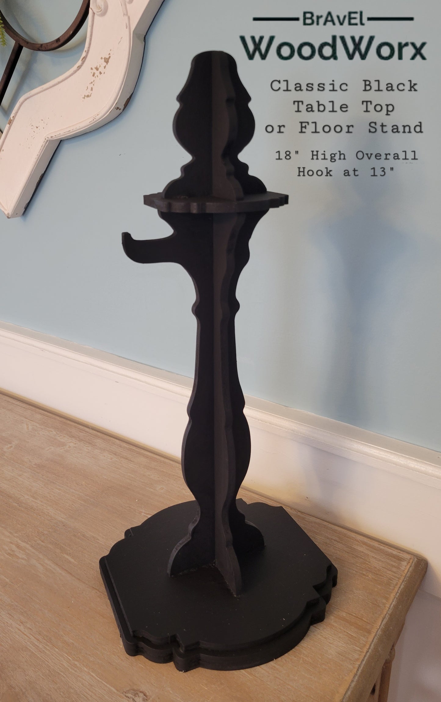 A wooden "Hello Winter" snowflake shelf stand featuring an intricate laser-cut snowflake design and the words "Hello Winter" in stylish script. Painted in a festive winter-themed color palette, it sits beautifully on a mantel or shelf, adding a cozy seasonal touch to your home decor. classic black