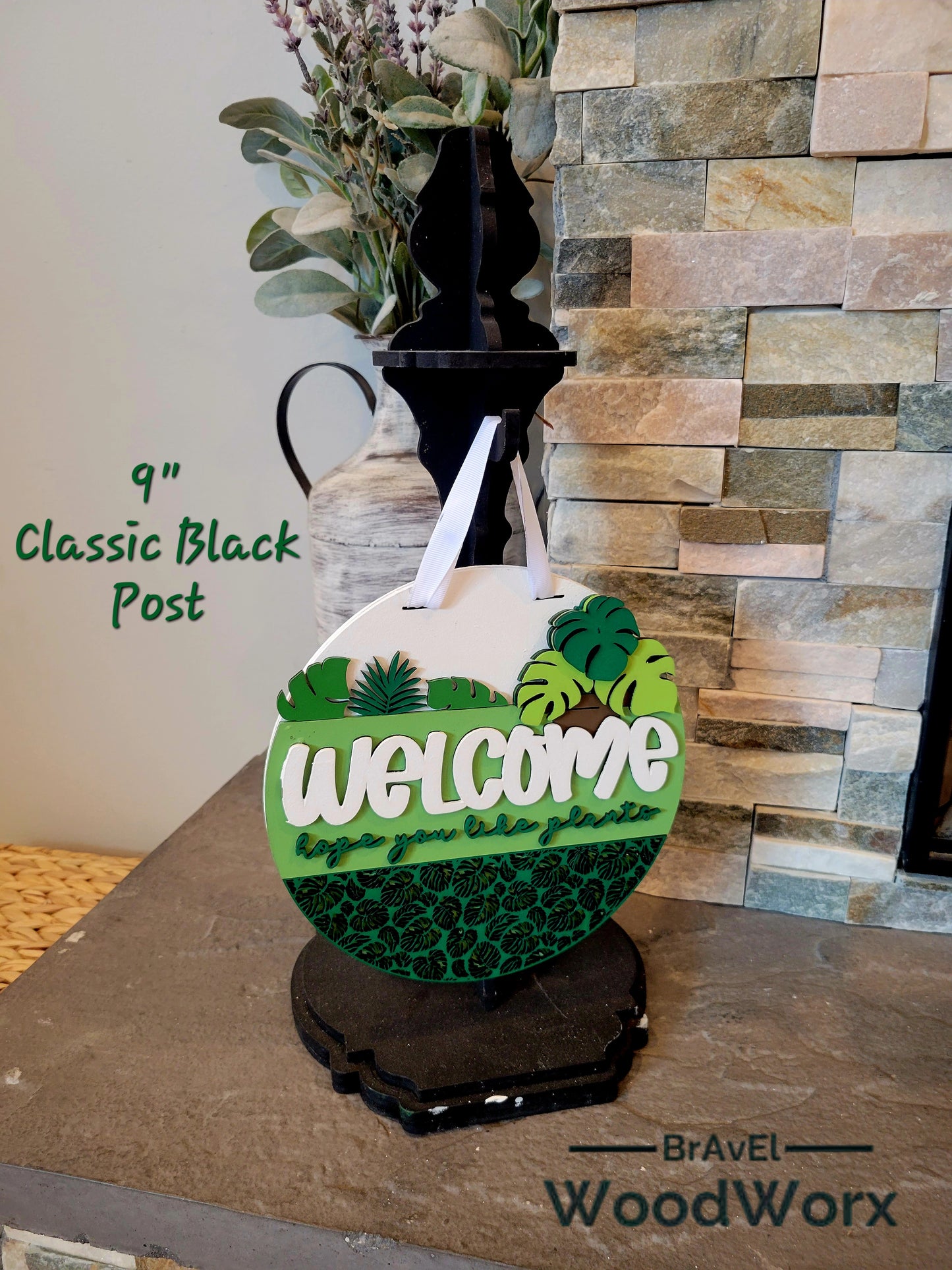 Decorative door sign with laser cut tropical leaf design and Welcome Plant Lovers text for indoor or outdoor display
