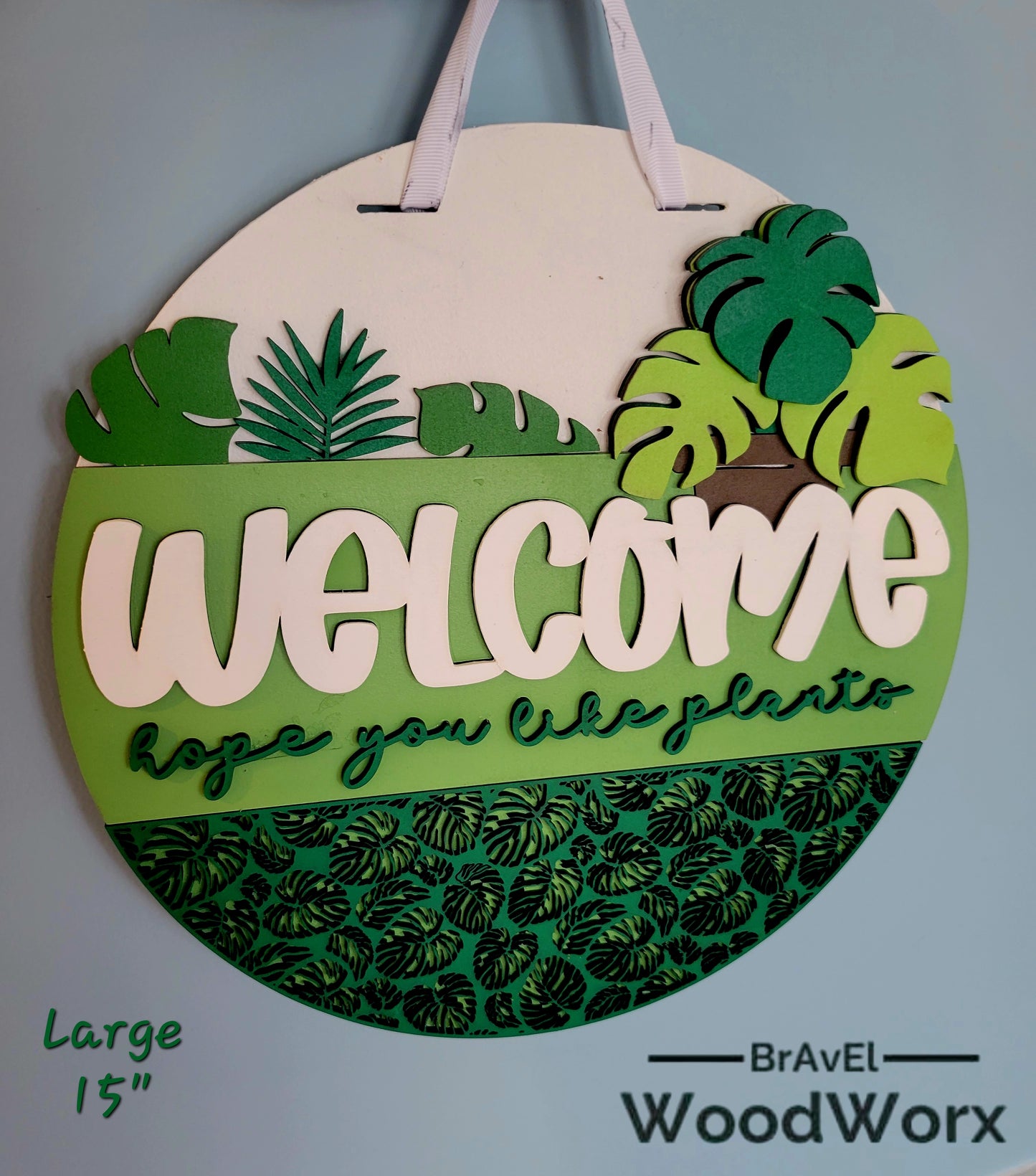 Indoor outdoor door decoration featuring Welcome Plant Lovers text and laser cut leaf design