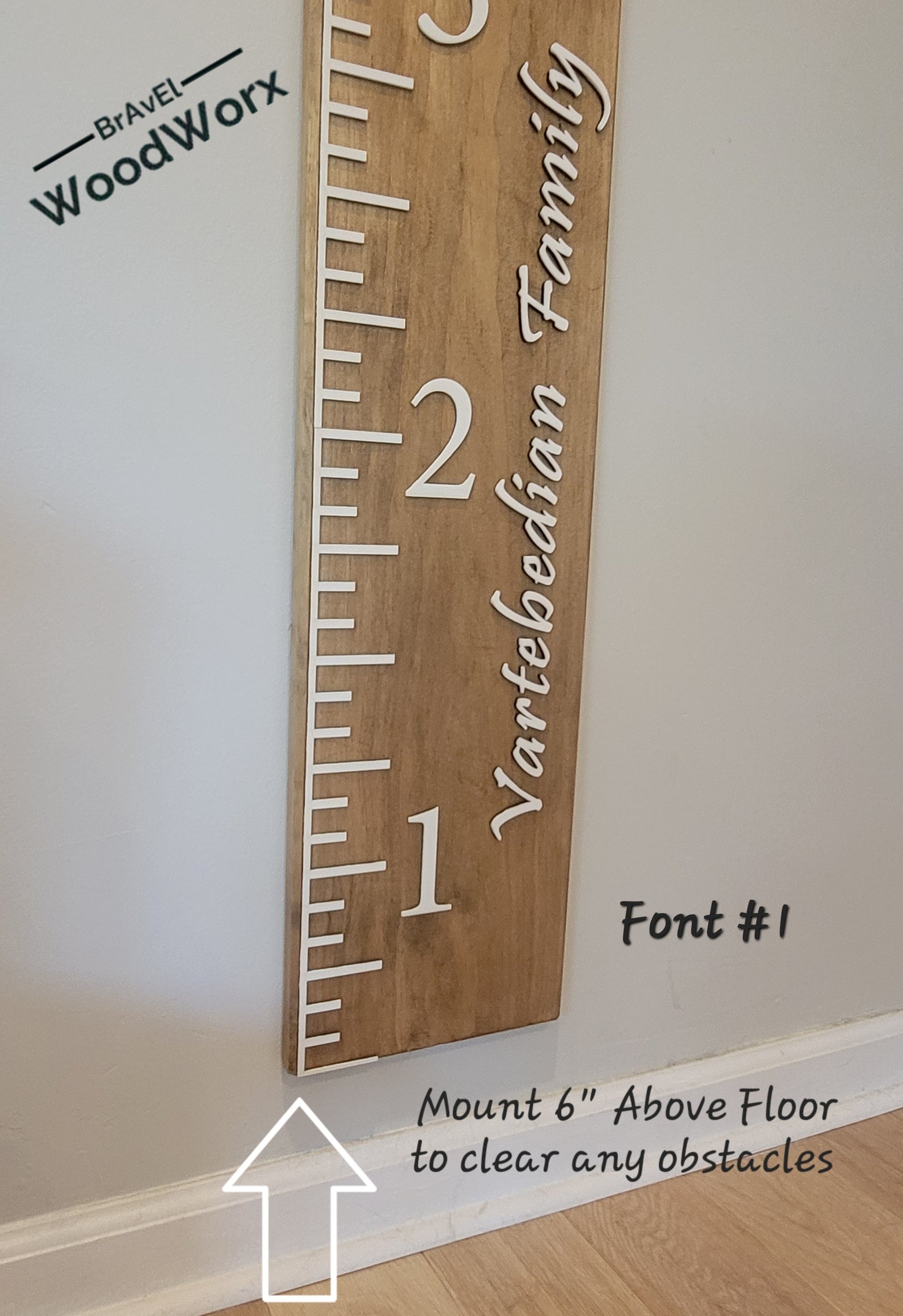 Wooden height chart with 'Vartebedian Family' and 'Brave WoodWorx' branding on a white wall.