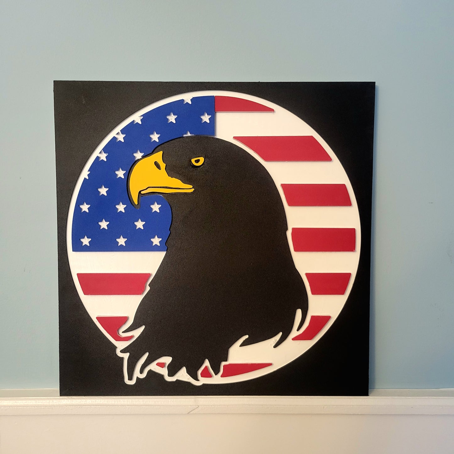 Durable, all-weather eagle and flag plaque displayed against a light blue wall