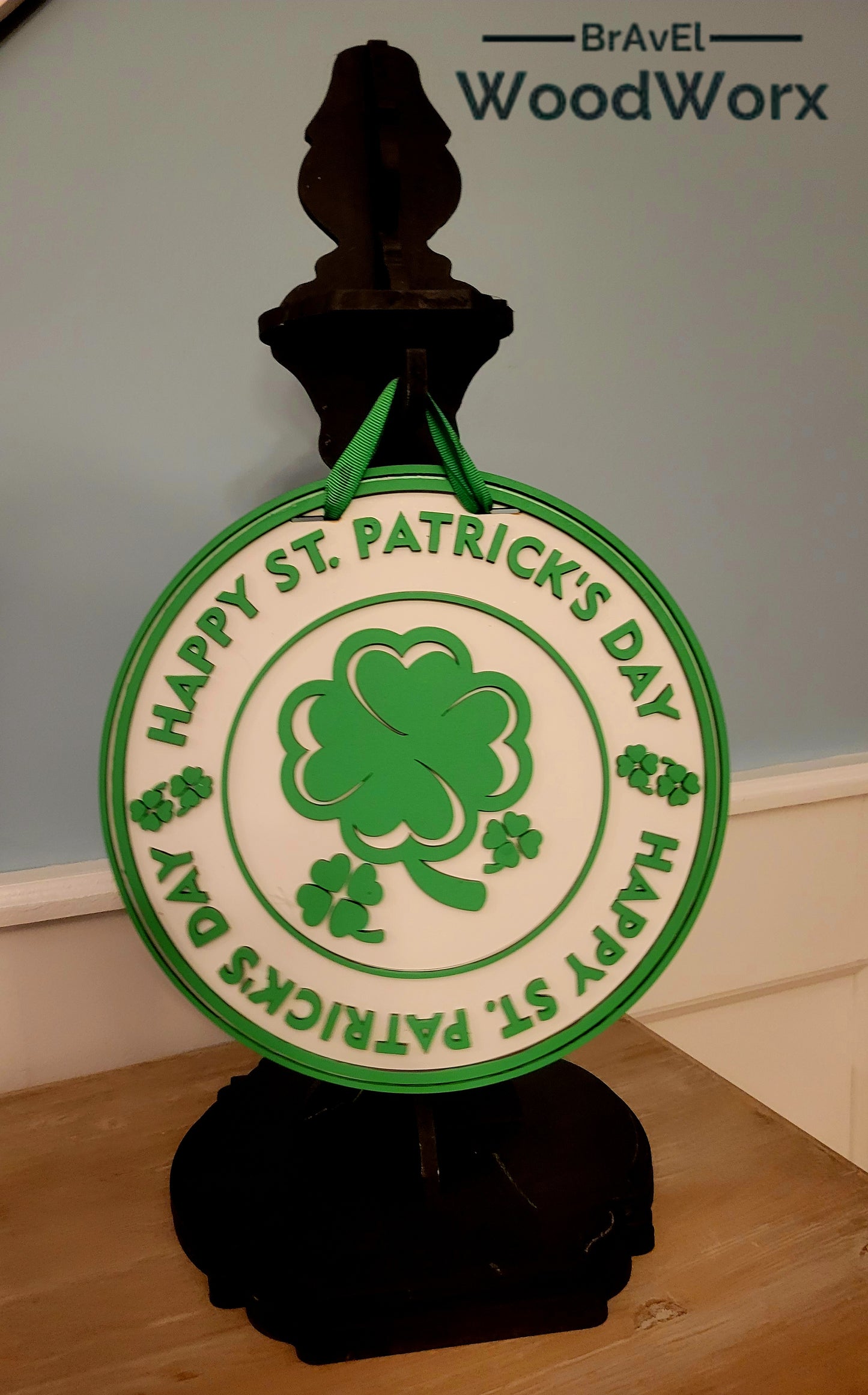 Happy St. Patrick’s Day ‘Round the Rings’ Door Hanger – Festive Shamrock Decor featuring a layered wooden ring design with vibrant green shamrocks, Celtic-inspired accents, and a cheerful holiday message. Perfect for front doors, entryways, or indoor wall decor to celebrate Irish pride and St. Paddy’s Day. Handmade, durable, and ideal for seasonal home decoration. #StPatricksDayDecor #ShamrockDoorHanger #IrishHolidayDecor Black Post Hanger