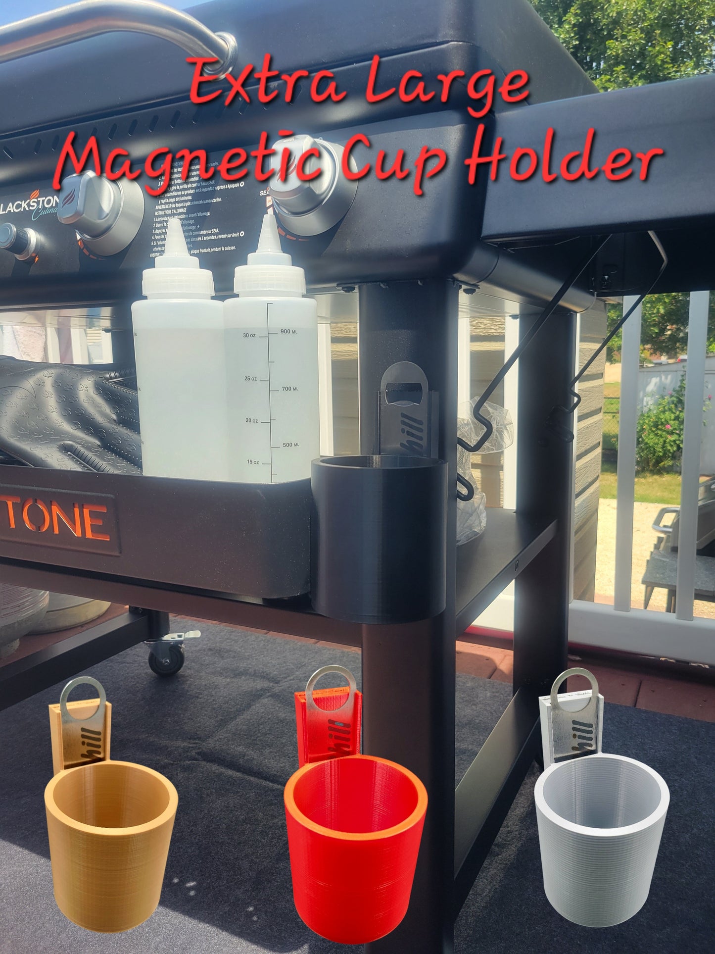 An extra large magnetic cup holder attached to a grill, holding various sized cups and a bottle, with the brand name 'Yeti' visible.