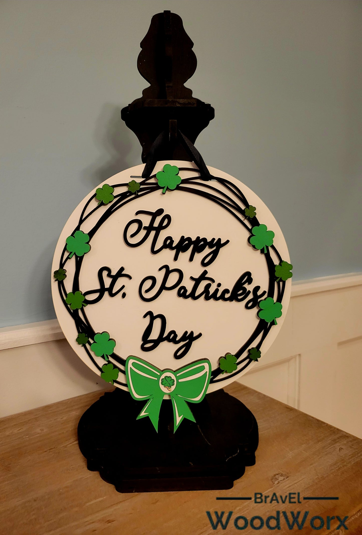 Festive St. Patrick’s Day Grapevine Door Hanger – Lucky Shamrock Decor handcrafted with a rustic grapevine base, vibrant green shamrocks, and festive embellishments. Perfect for front doors, porches, or indoor wall decor to bring Irish charm and good luck to your home. Ideal for St. Paddy’s Day celebrations and seasonal decorating. #StPatricksDayDecor #ShamrockDoorHanger #LuckyIrishDecor Black Post Hanger