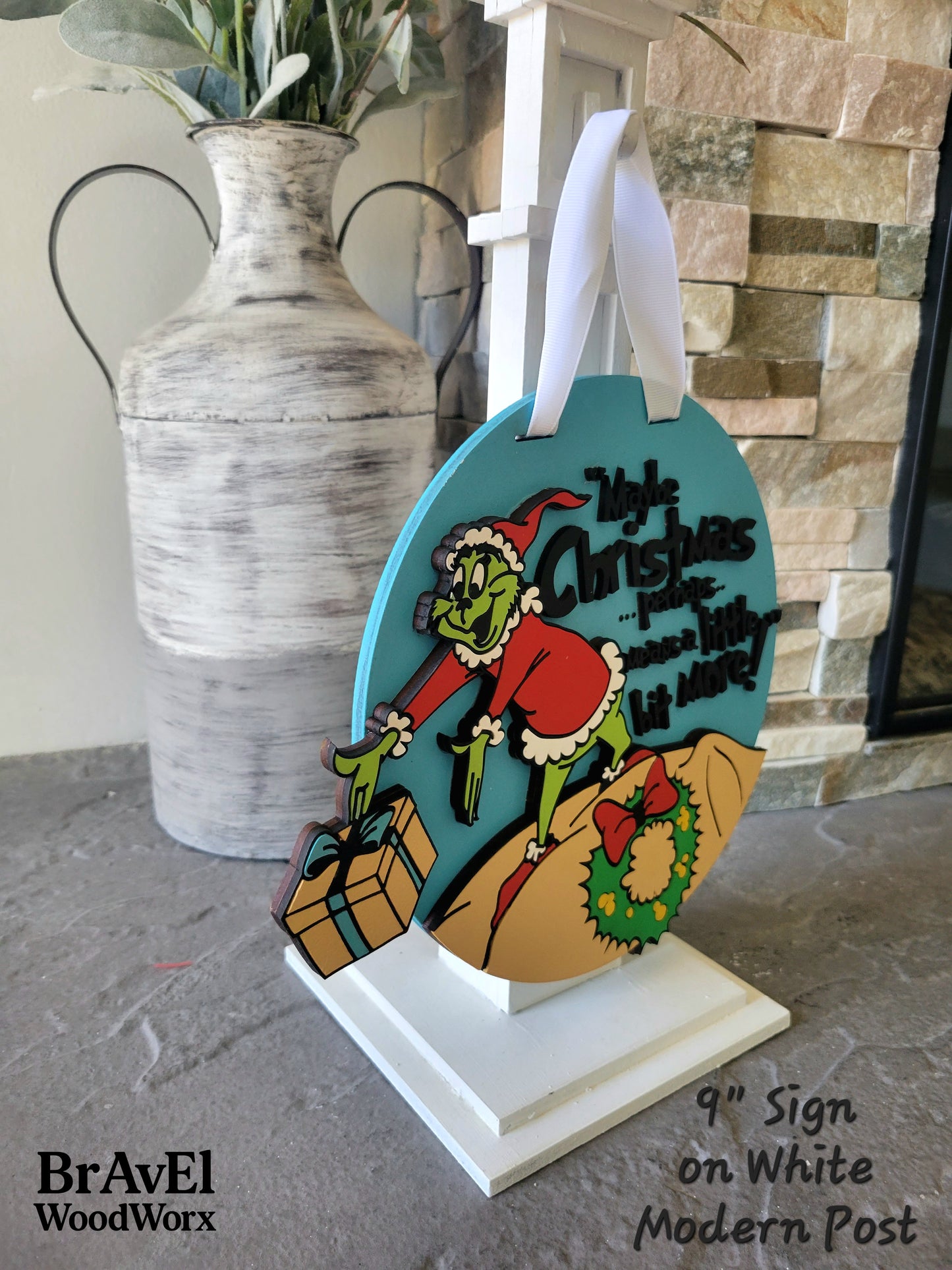 Decorative sign with cartoon character on a stand, featuring 'BrAvEl WoodWorx' branding.