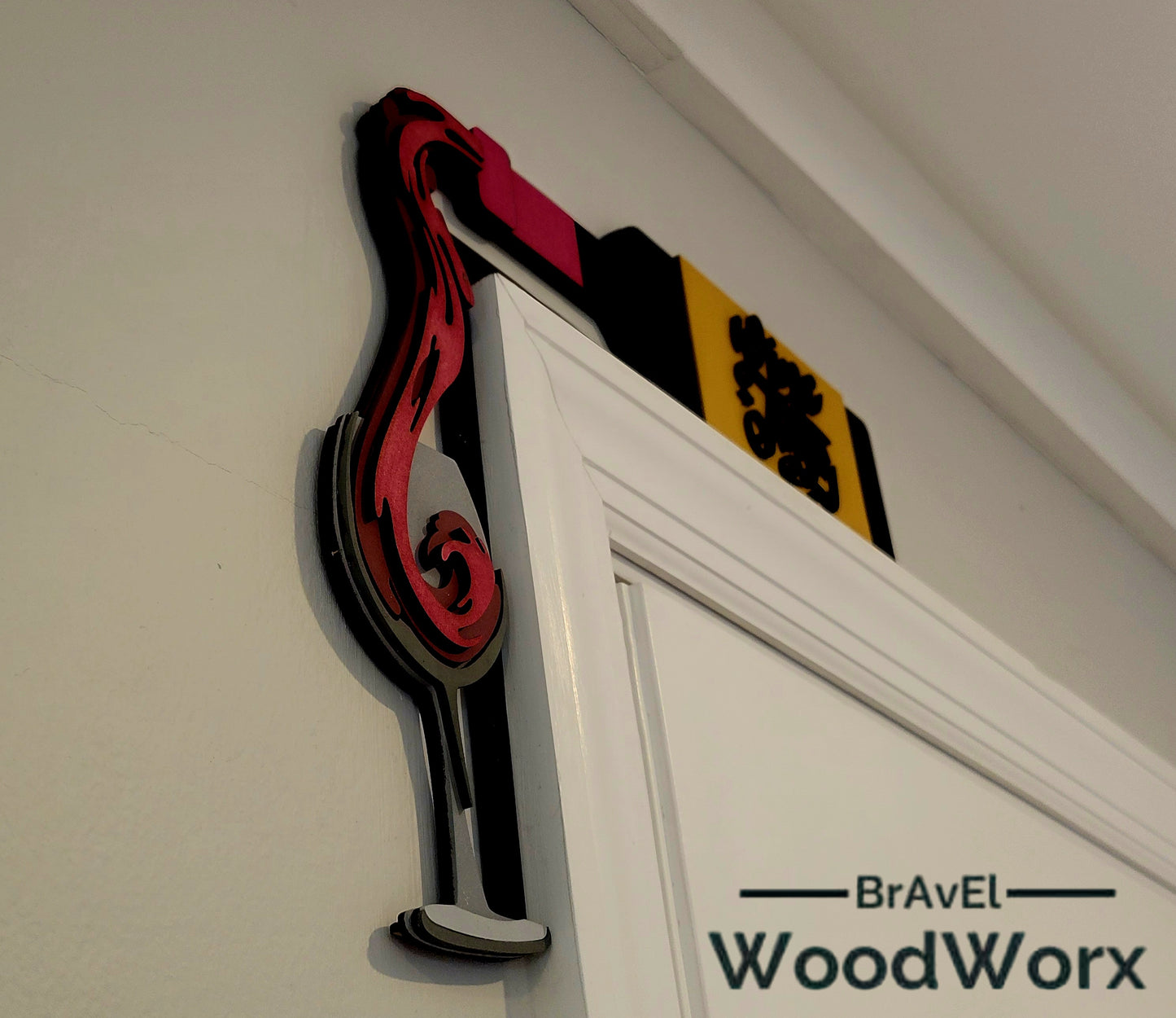 Side view Wine Therapy door trim hanger: A beautifully crafted wooden sign featuring the words 'Wine Therapy' elegantly engraved. The sign is designed to hang seamlessly on a door trim, adding a touch of charm and personality to any space. Perfect for wine enthusiasts and as a thoughtful gift.