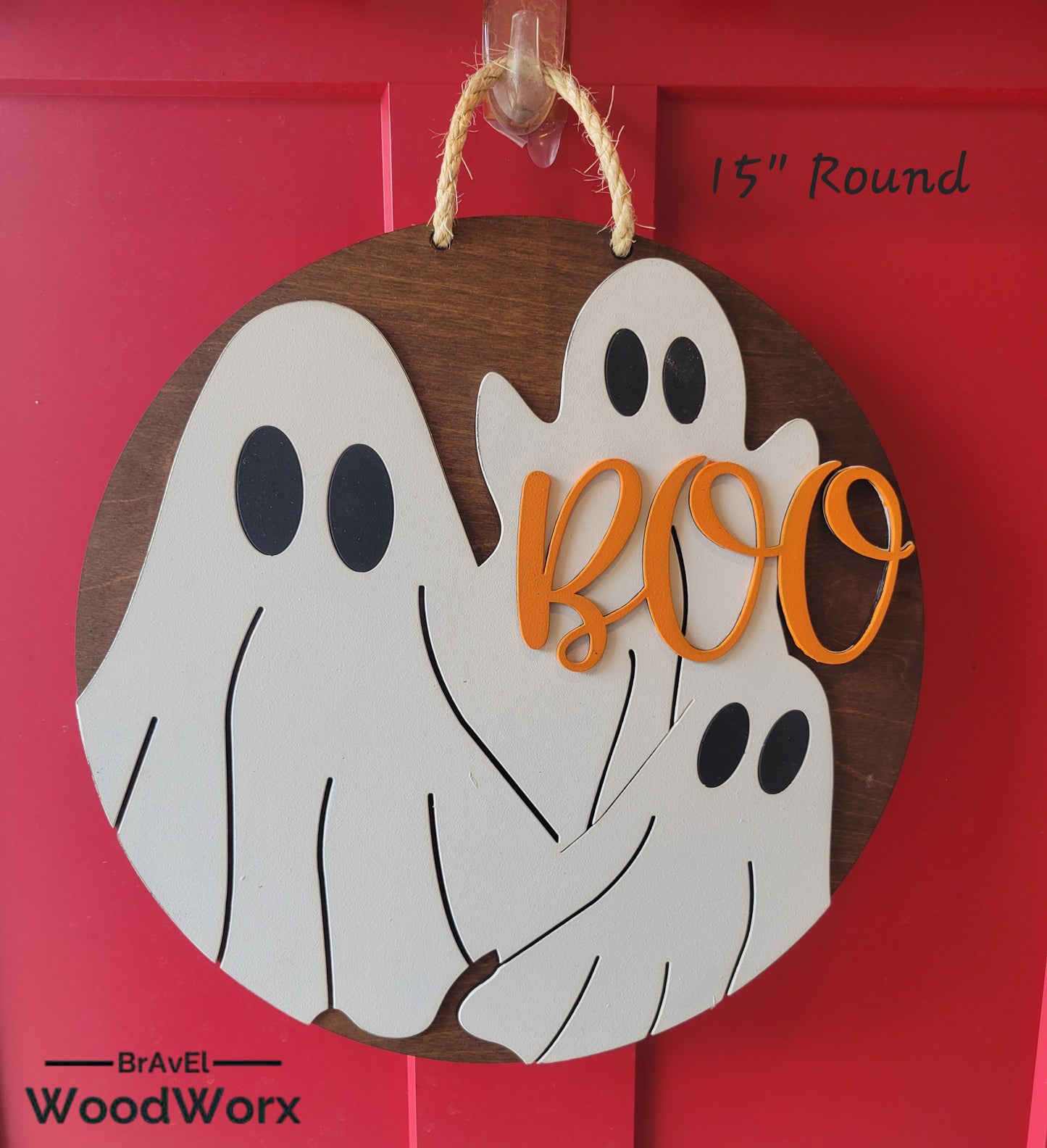 Handmade round wood Halloween sign with Boo text in rustic farmhouse style wall decor