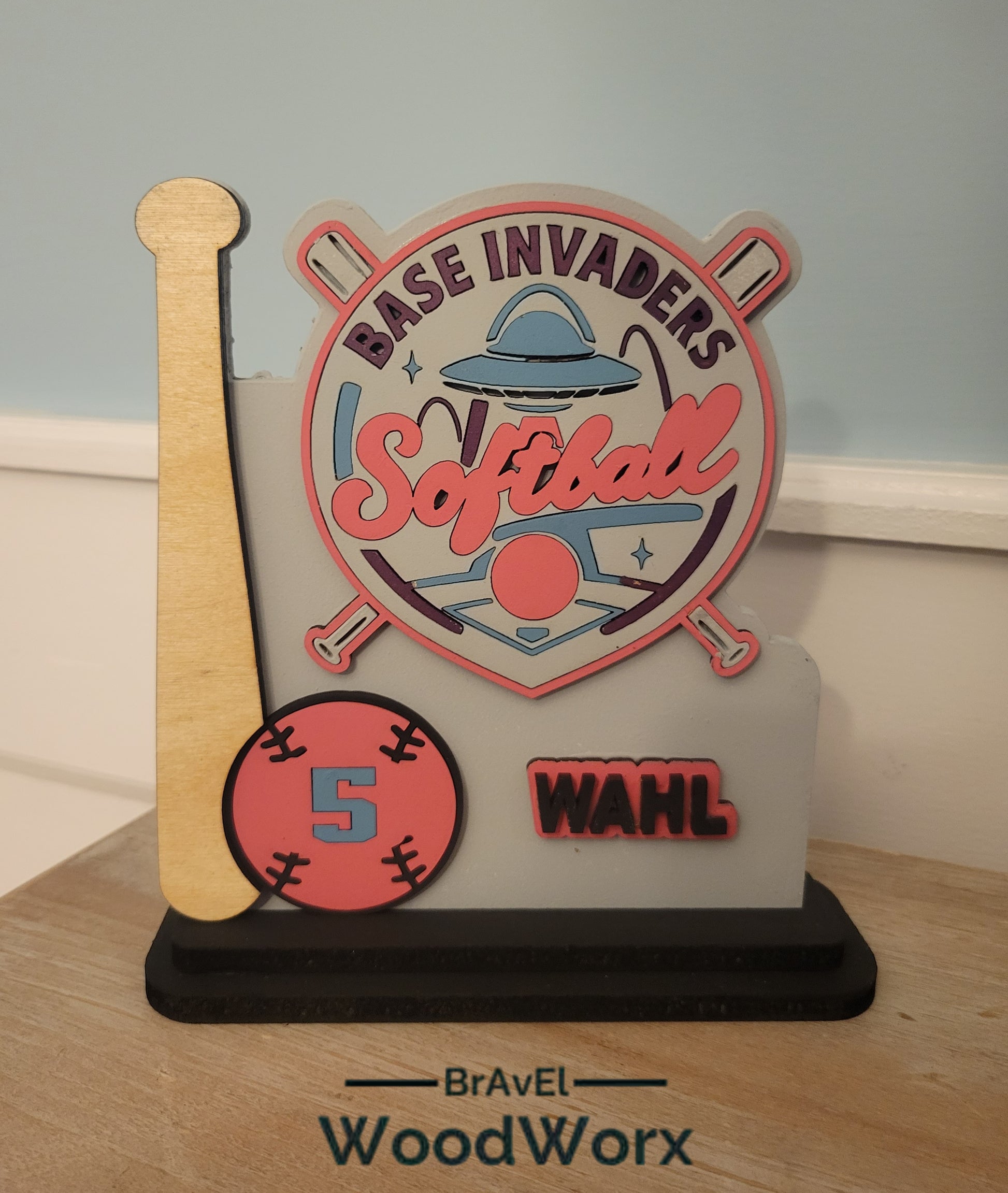 Custom youth softball trophy with personalized player name and number on wood base