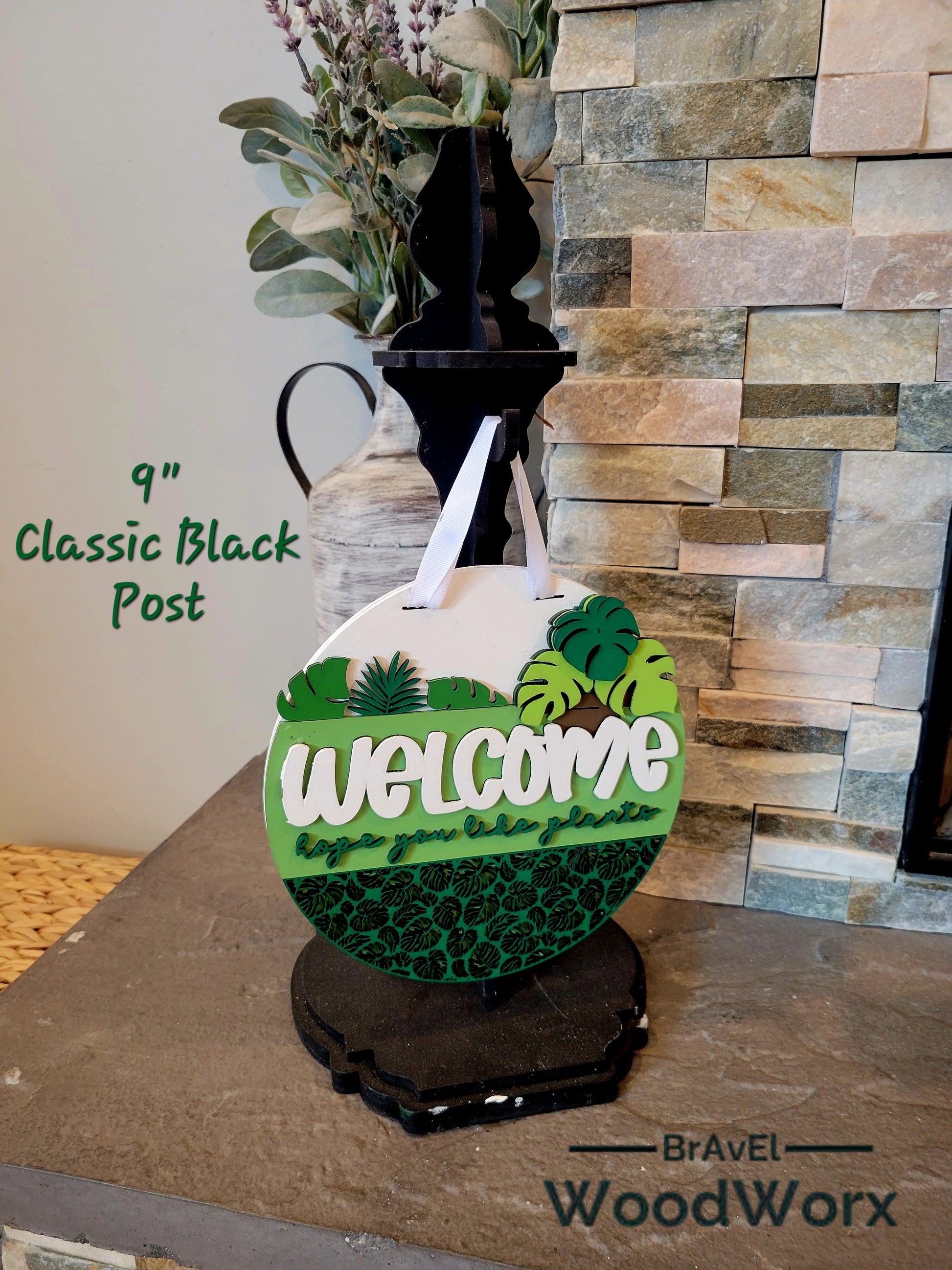 Decorative door sign with laser cut tropical leaf design and Welcome Plant Lovers text for indoor or outdoor display