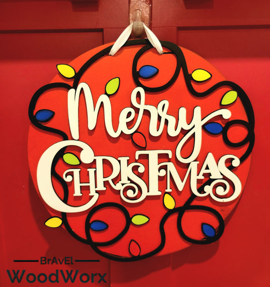 Handmade Merry Christmas door sign with colorful holiday lights on a red wood background.