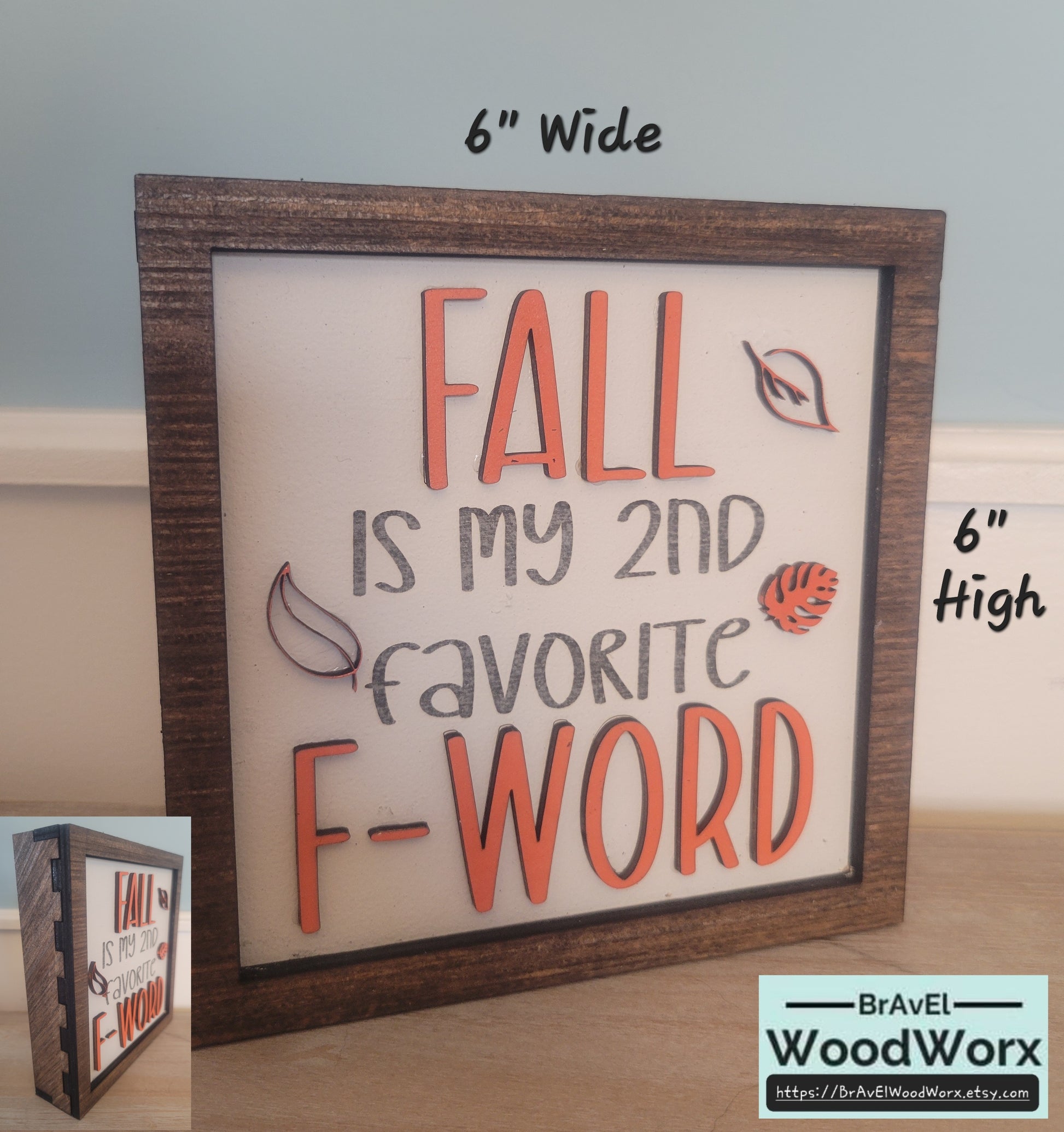 A square-shaped wooden sign with a text that reads 'Fall is my 2nd Favorite F Word' accompanied by images of autumn-related items like leaves and pumpkins. The sign is 6 inches wide.