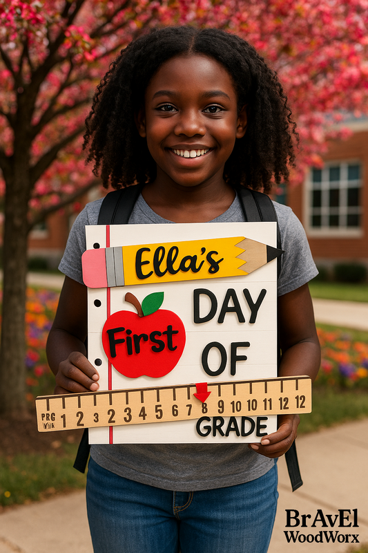 Young girl holding a 'First Day of Grade' sign with cherry blossoms in the background