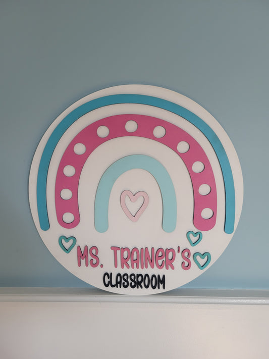 Decorative sticker with a rainbow design and text on a blue wall