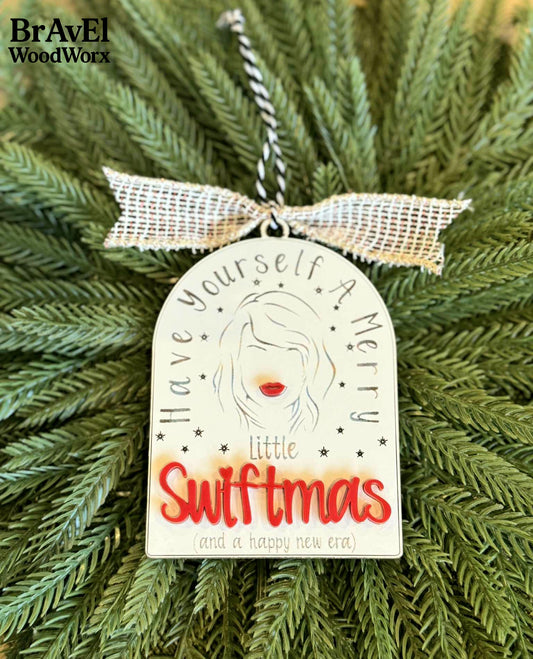 Decorative ornament with 'Have yourself a merry little Swiftmas' text on a Christmas tree, featuring BravEl WoodWorx branding.